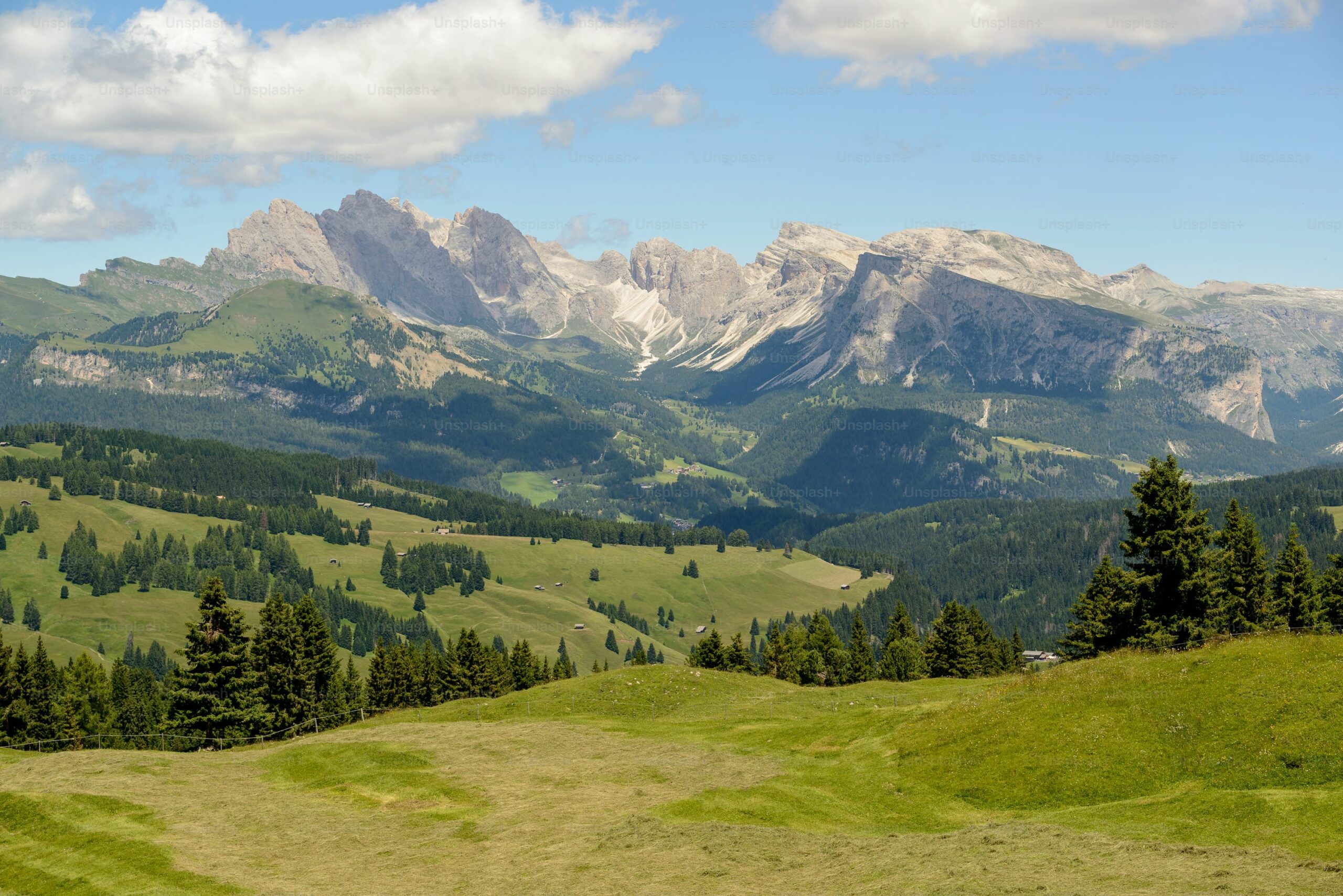 A valley view with lush greenery and mountains.