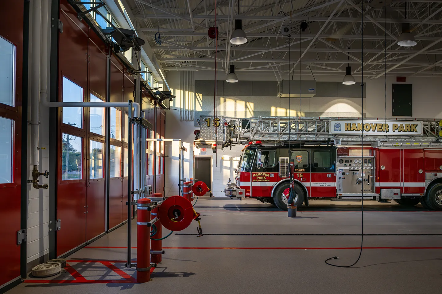 Inside the garage bays of the updated Hanover Park Fire Station, a filtered air system (seen above the fire truck) cleans the air of viruses.