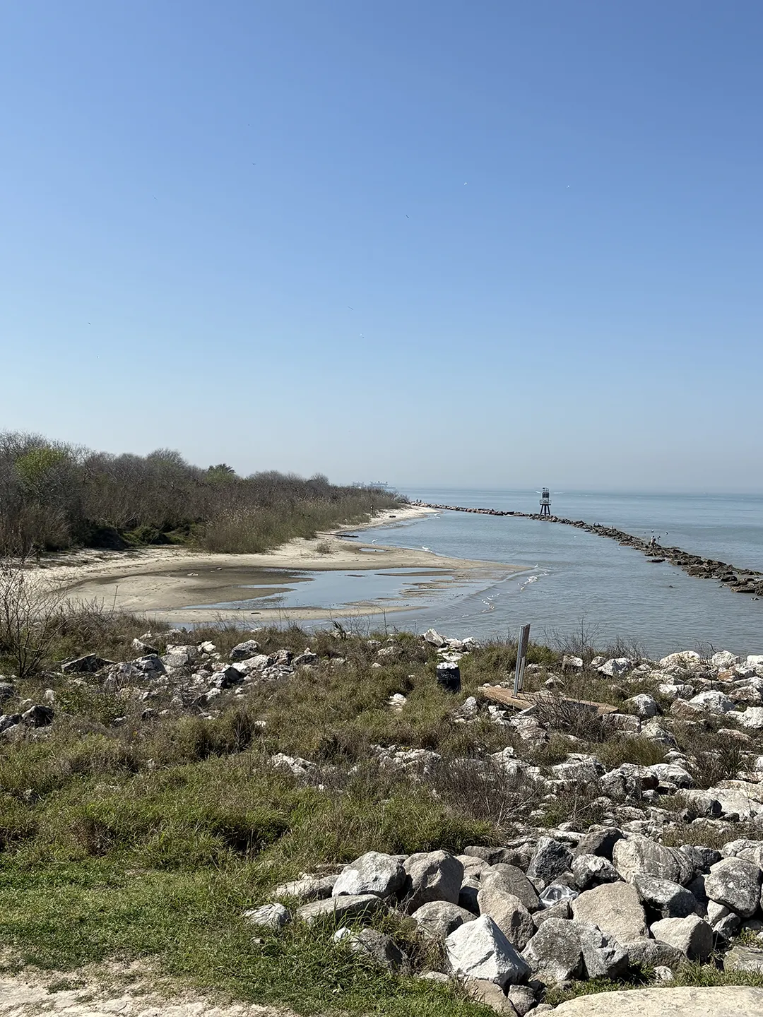 Our firm is working on a project along Coastal Texas to design and construct rock sill revetments to mitigate storms. Pictured is an example of a rock sill revetment in Galveston along the Houston Ship Channel.