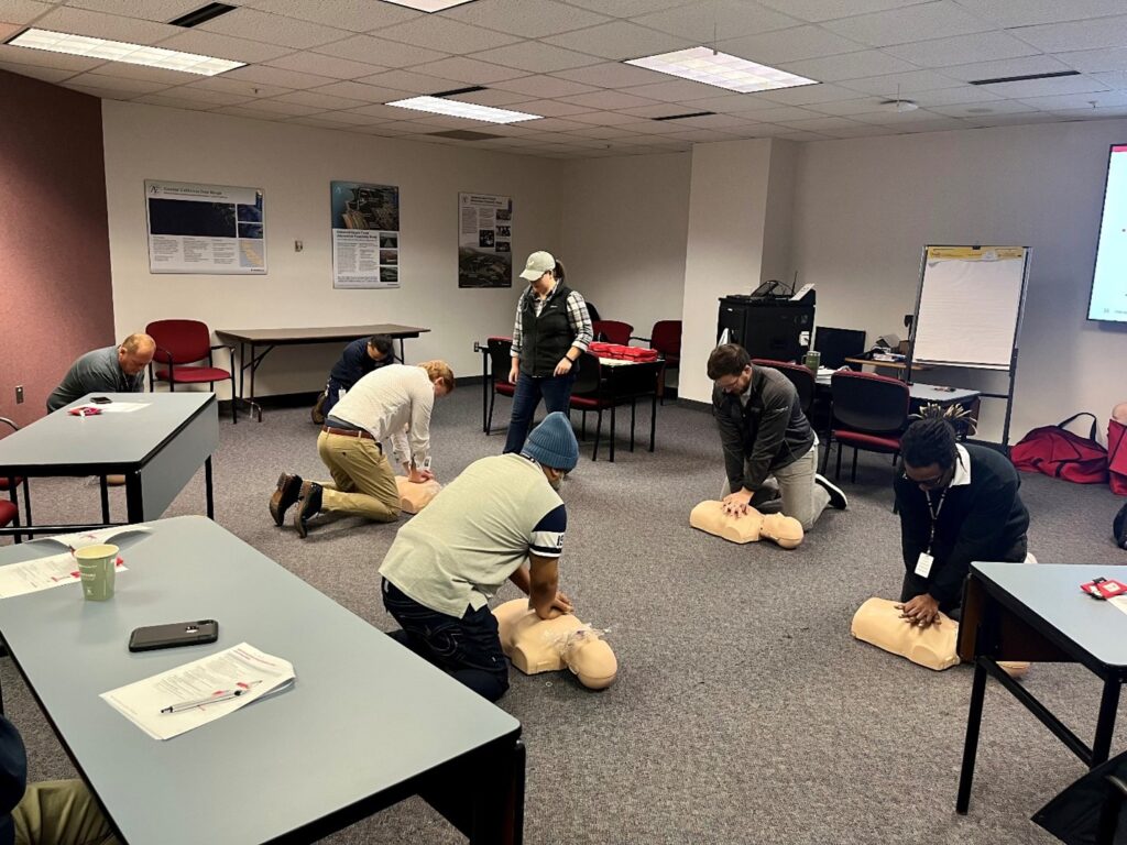 Elaine Browning providing cardiopulmonary resuscitation (CPR) training to staff.