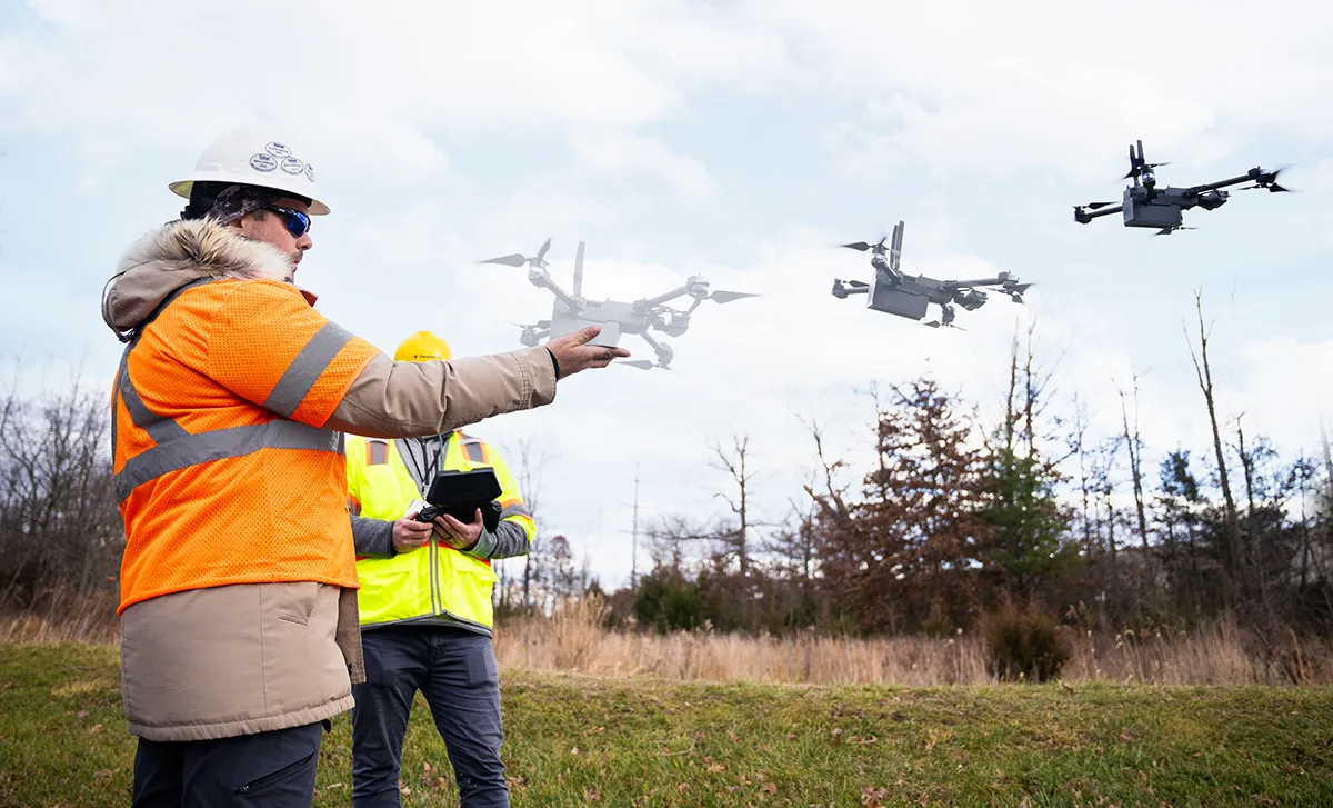 Dewberry's certified UAV pilots training with our latest acquired drone – the Skydio X2E.