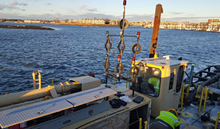 Utilization of Passive and Active Mechanical Dewatering Technologies to Process Navigational Dredged Material on a Small Footprint