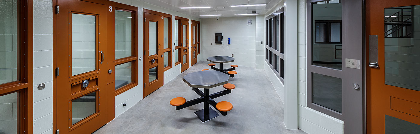 The holding cell dayrooms allow prisoners to be held temporarily, pending charge, trial, or sentencing.