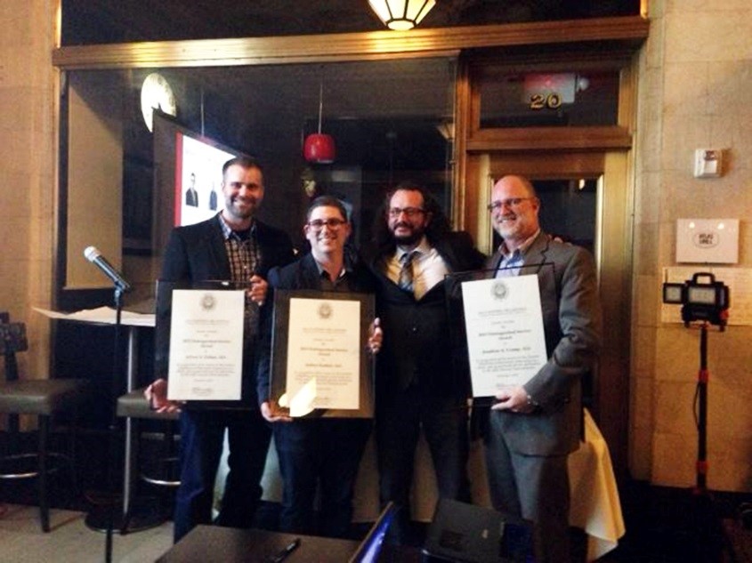 Jonathan Crump (right) accepting his Distinguished Service Award.