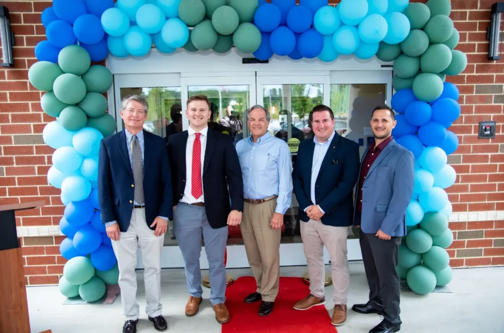 Dewberry Project Manager Bryan Focht, clients, and the project team celebrate at the ribbon cutting. Photo courtesy of Lambano.