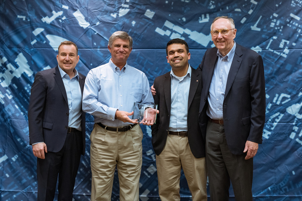 Jeffrey Peters (ESRI), Phil Thiel (Dewberry), Sid Pandey (Dewberry), and Jack Dangermond (ESRI). Photo courtesy of Esri. Manuel Lopez, photographer.