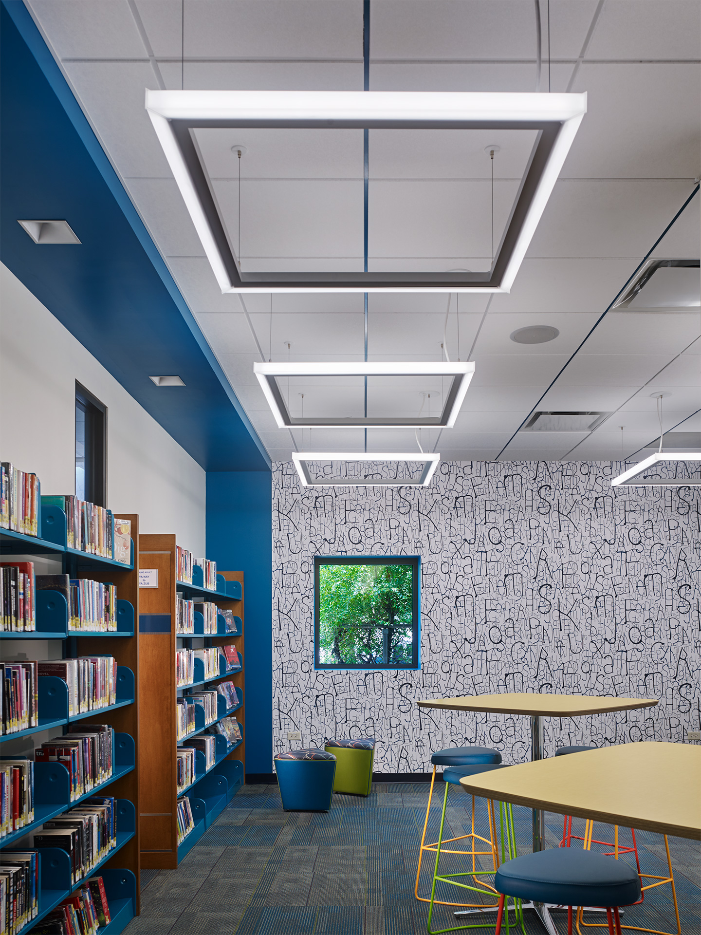 A designated teen area provides autonomy of collections and an identity for this critical community group while maintaining the ability for staff to visually supervise and assist with any needs.