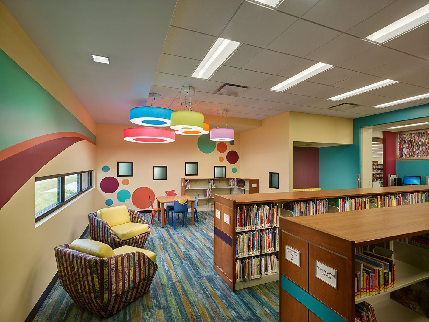 Separate from other collections, the children’s area forms a haven for parents to introduce their little ones to the joy of books and reading through a variety of fully open and more sheltered alcoves.