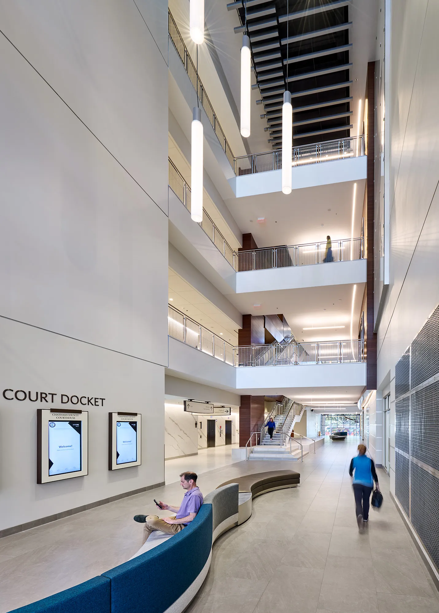 The design splits the programmatic functions of the building on either side of the lane and visually carries the lane through the building’s four-story atrium.