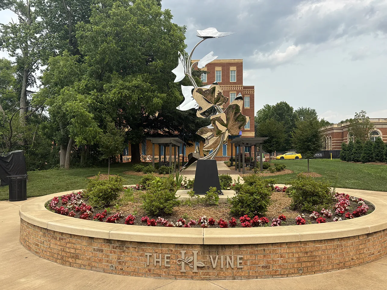The trailhead includes a pedestrian plaza, where the town has placed a sculpture.