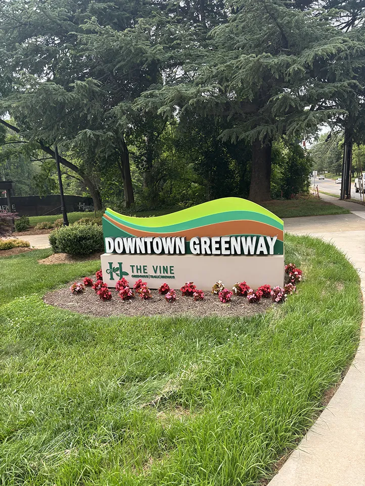 As shown on the sign, the Downtown Greenway segment is part of a larger system known as “The Vine.”