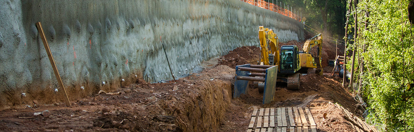 Set on a severe slope, the project required the design and construction of a major retaining wall to allow for safe excavation, protection to a major gas line, and upgradient roadway and railroad.