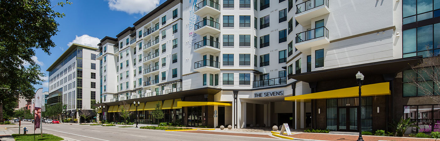 The development includes a parking garage accommodating more than 600 onsite parking spaces, offsite parallel spaces, an onsite loading/unloading zone, trash compactor enclosure, and an exfiltration system for stormwater treatment and attenuation.