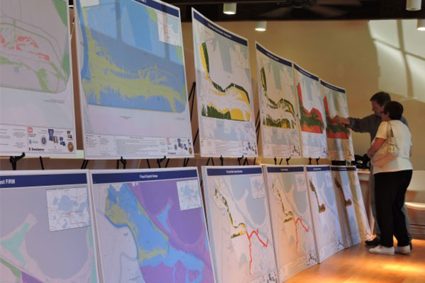Maps and diagrams of the parish's flood risk reduction techniques and interior drainage systems.