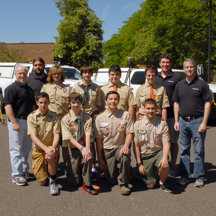 Dewberry’s Robert Telschow and colleagues supervise scouts on survery merit badge day.