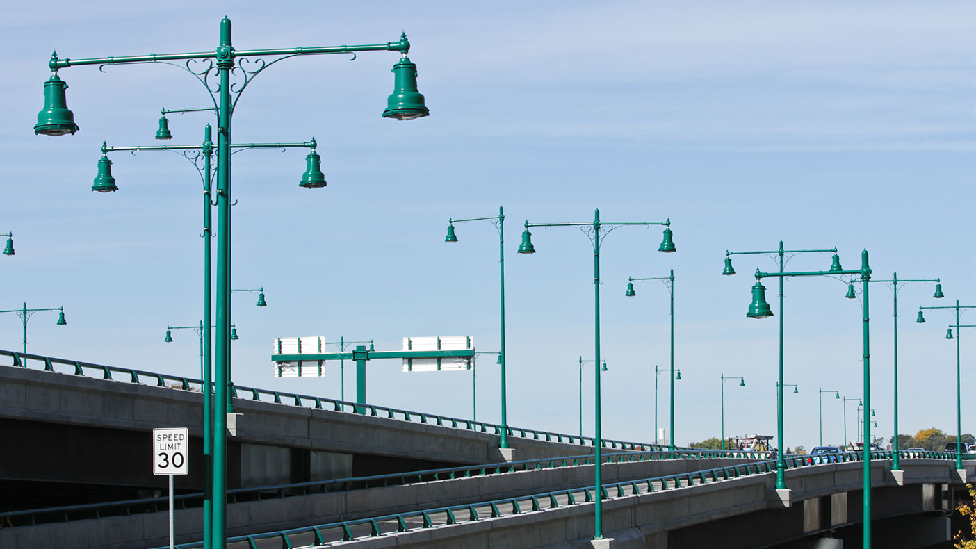 Aesthetic improvements included site specific lighting fixtures and railings to visually connect the bridge to the adjacent Quincy Shore Drive parkway environment.