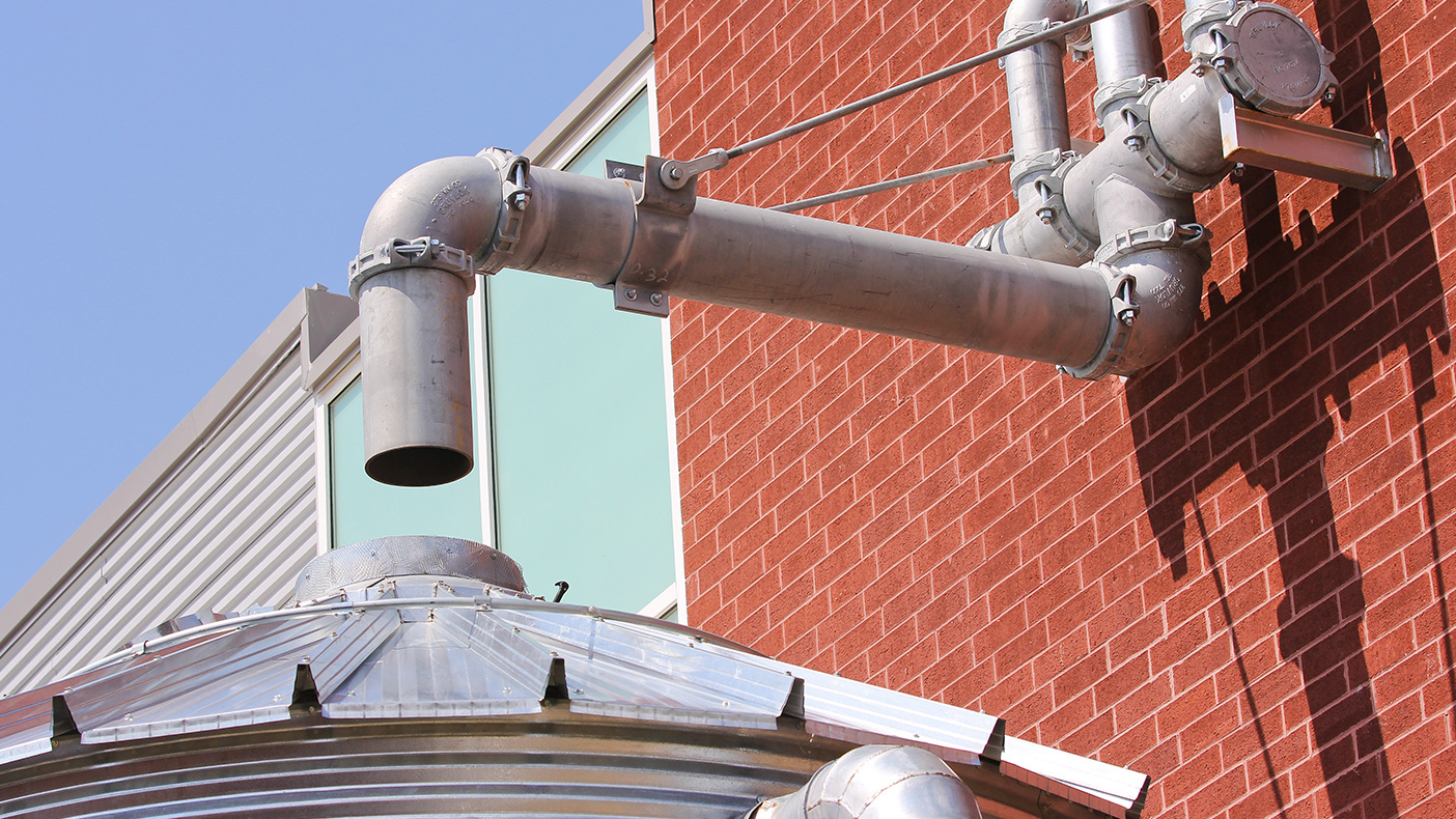Sustainable design elements in the facility include a vegetated roof to reduce run-off, cistern for capturing rainwater, mechanical system that uses chilled beam technology and heat recovery, advanced solar sensor controls, and optimized ventilation.